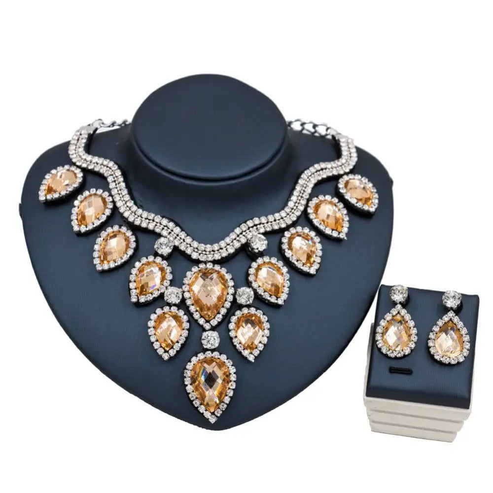 Elegant gold-toned and silver rhinestone colorful exaggerated bride necklace and earring set with amber teardrop stones