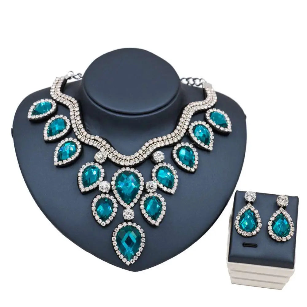 Teal and silver colorful exaggerated bride necklace and earring set with teardrop-shaped crystals for bridal wear