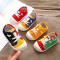 Colorful kindergarten indoor shoes with rubber soles designed in red blue yellow green and black canvas with white laces