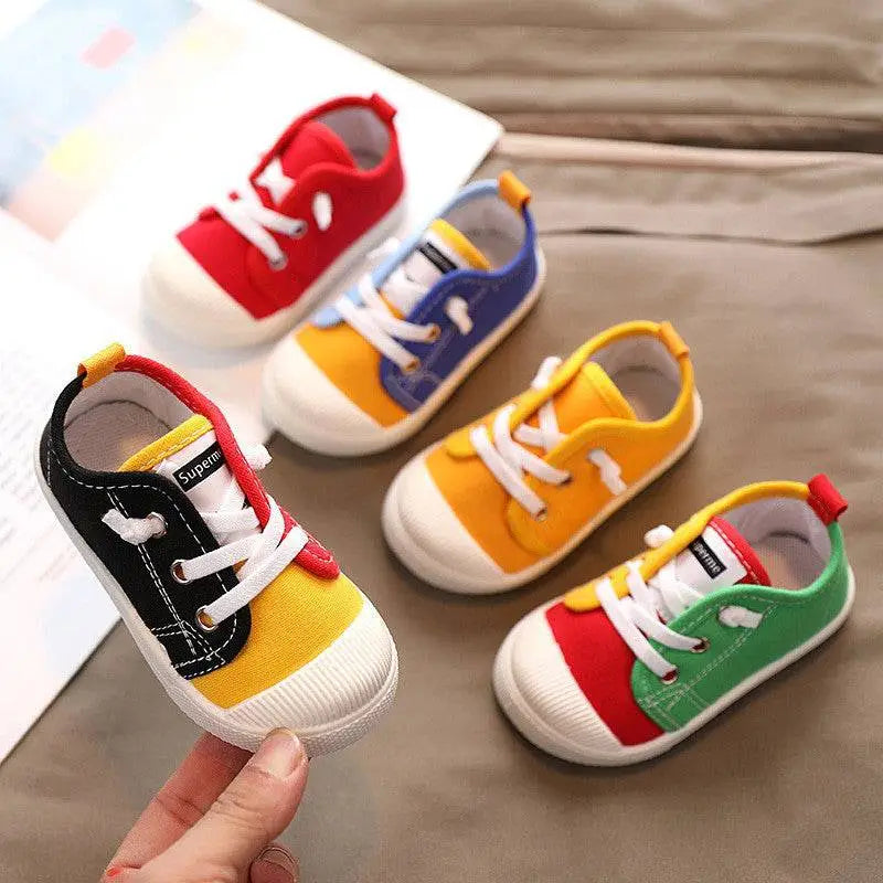 Colorful kindergarten indoor shoes with rubber soles designed in red blue yellow green and black canvas with white laces