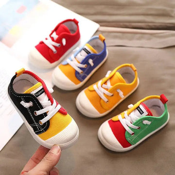 Colorful kindergarten indoor shoes with rubber soles designed in red blue yellow green and black canvas with white laces