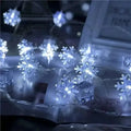 Colorful led snowflake lights featuring translucent blue snowflake-shaped leds on a decorative string