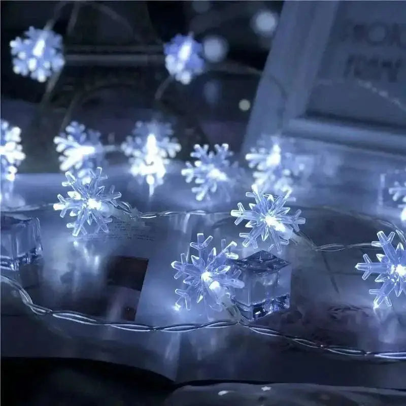 Colorful led snowflake lights featuring translucent blue snowflake-shaped leds on a decorative string
