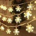 String of warm white colorful led snowflake lights with translucent snowflake-shaped bulbs for festive decor