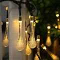 Colorful teardrop bubble garden solar lights with warm glowing textured glass bulbs and multiple lighting modes
