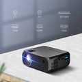 Compact black high definition screen projector home with textured surface and multiple connectivity ports shown from back