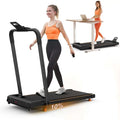 Black compact desktop treadmill with orange accent feet and digital display panel for home office desk use