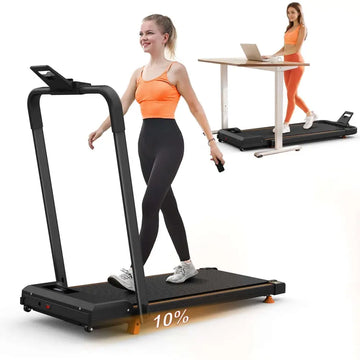 Black compact desktop treadmill with orange accent feet and digital display panel for home office desk use