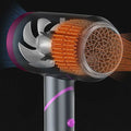 Compact folding style hair dryer with wind nozzle in silver and purple and transparent design revealing components