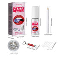 Complete tooth gem kit with pink and white packaging includes dental adhesive, clear crystals, applicator sticks, and red light