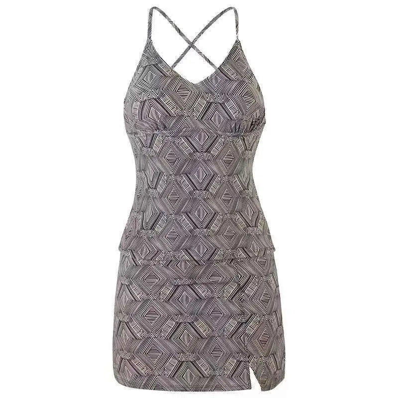 A fitted sleeveless mini dress with thin straps in dark gray and white conservative artistic color split geometric pattern