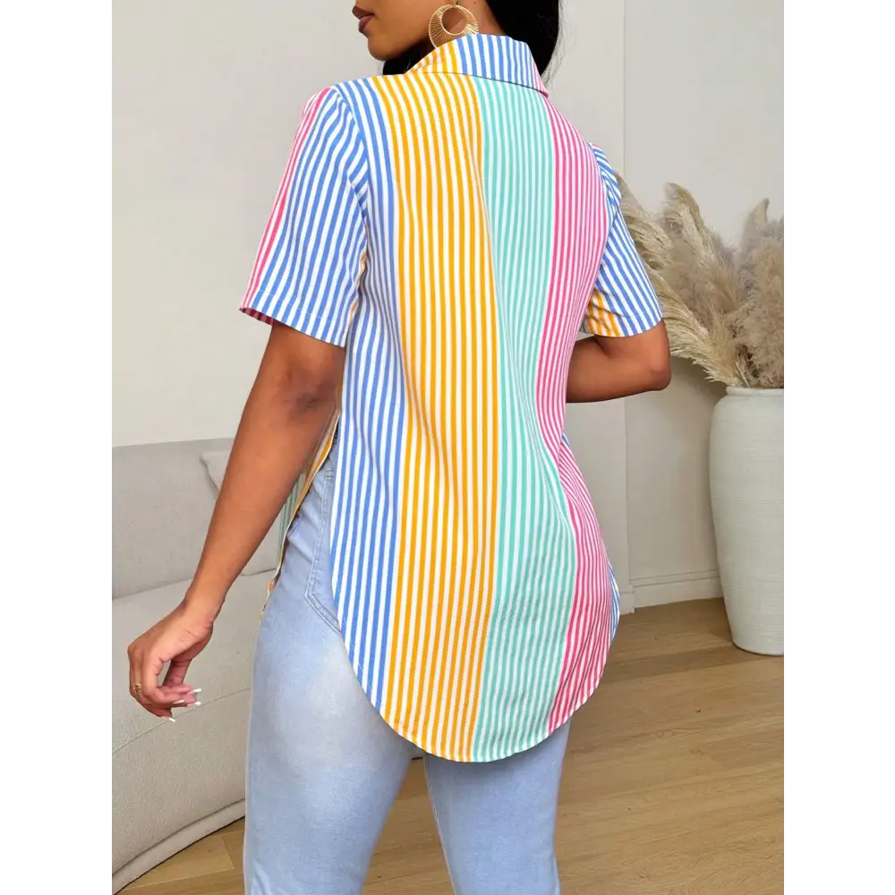 A vibrant contrast color striped button asymmetrical hem shirt with pastel blue yellow mint green and pink vertical stripes