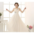 A flowing ivory chiffon evening dress with single-shoulder design and delicate beaded embellishments on the bodice