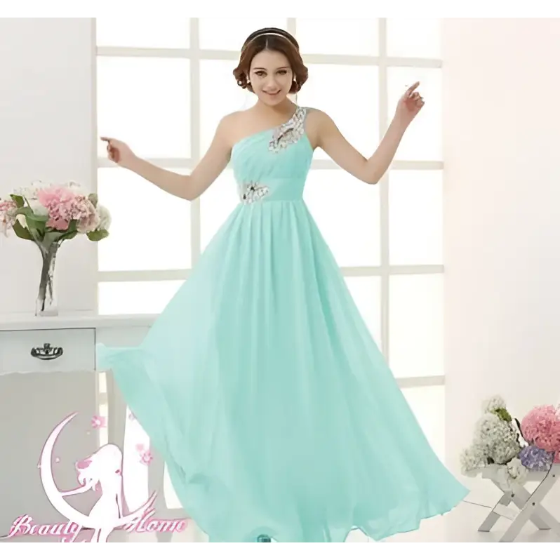 A mint green chiffon evening dress with delicate beaded embellishments along the one-shoulder neckline