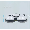 White and black cordless robot window cleaner with a circular design and gray microfiber cleaning pads at the base