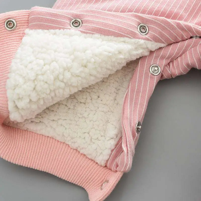 Pink and blue corduroy bunny baby winter clothes onesie with white fleece-lined ears cuffs and hood for warmth