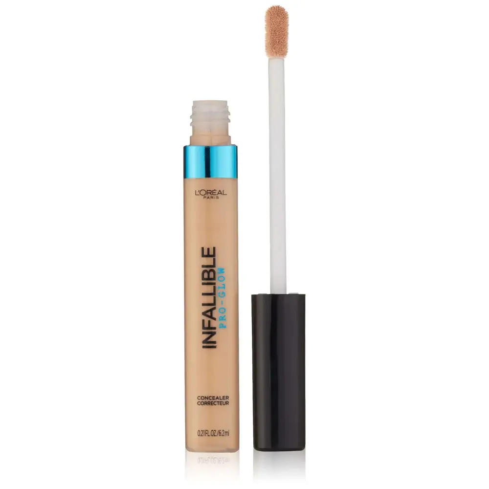 L’oréal paris cosmetics infallible pro glow concealer in nude beige with blue cap and white applicator in beige tube