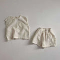 Off-white cotton muslin breathable vest shorts set with a soft textured weave lightweight and comfortable