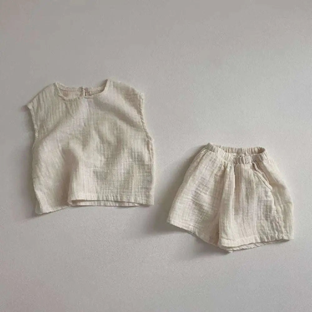 Off-white cotton muslin breathable vest shorts set with a soft textured weave lightweight and comfortable