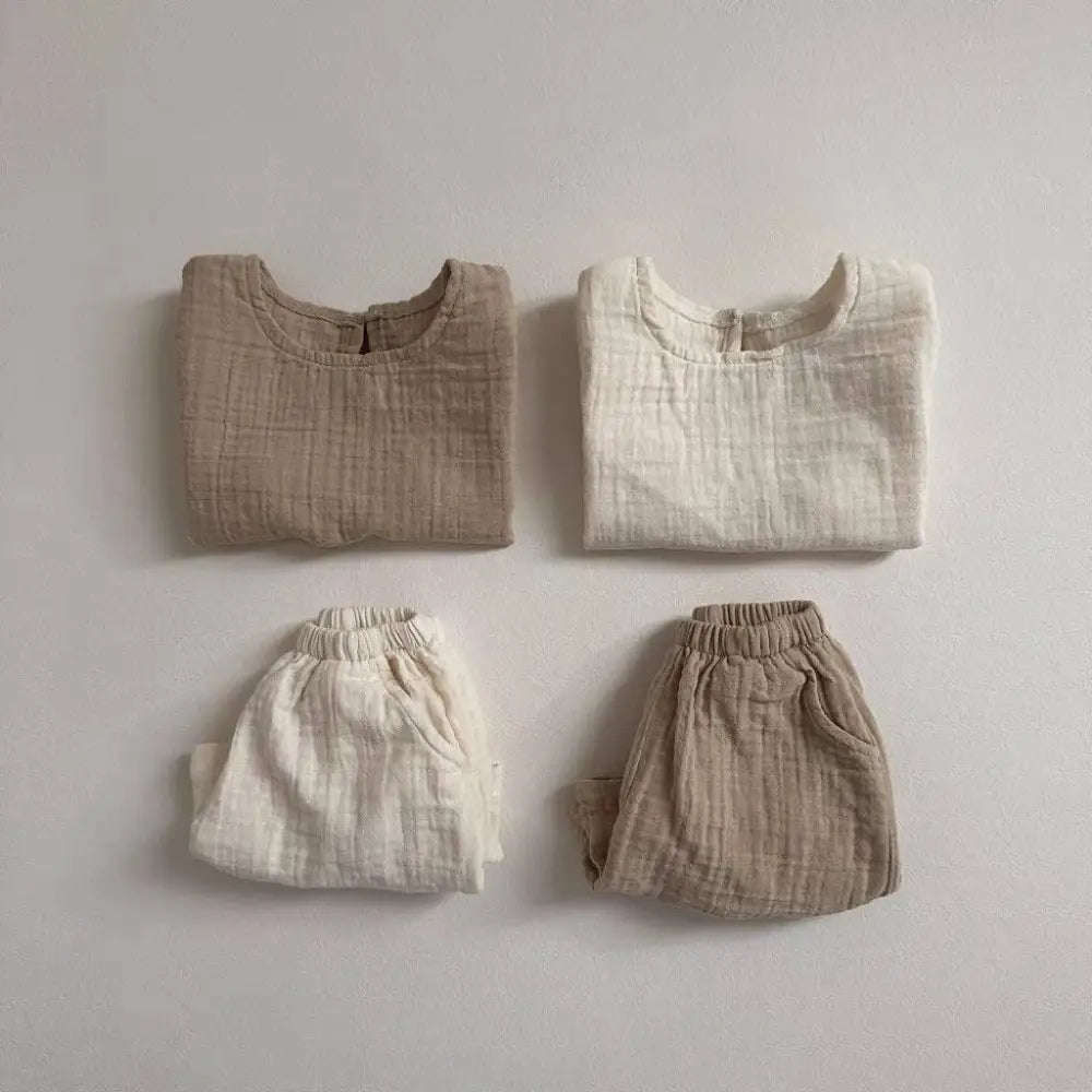 Two matching breathable vest shorts sets in warm beige and off-white cotton muslin breathable fabric