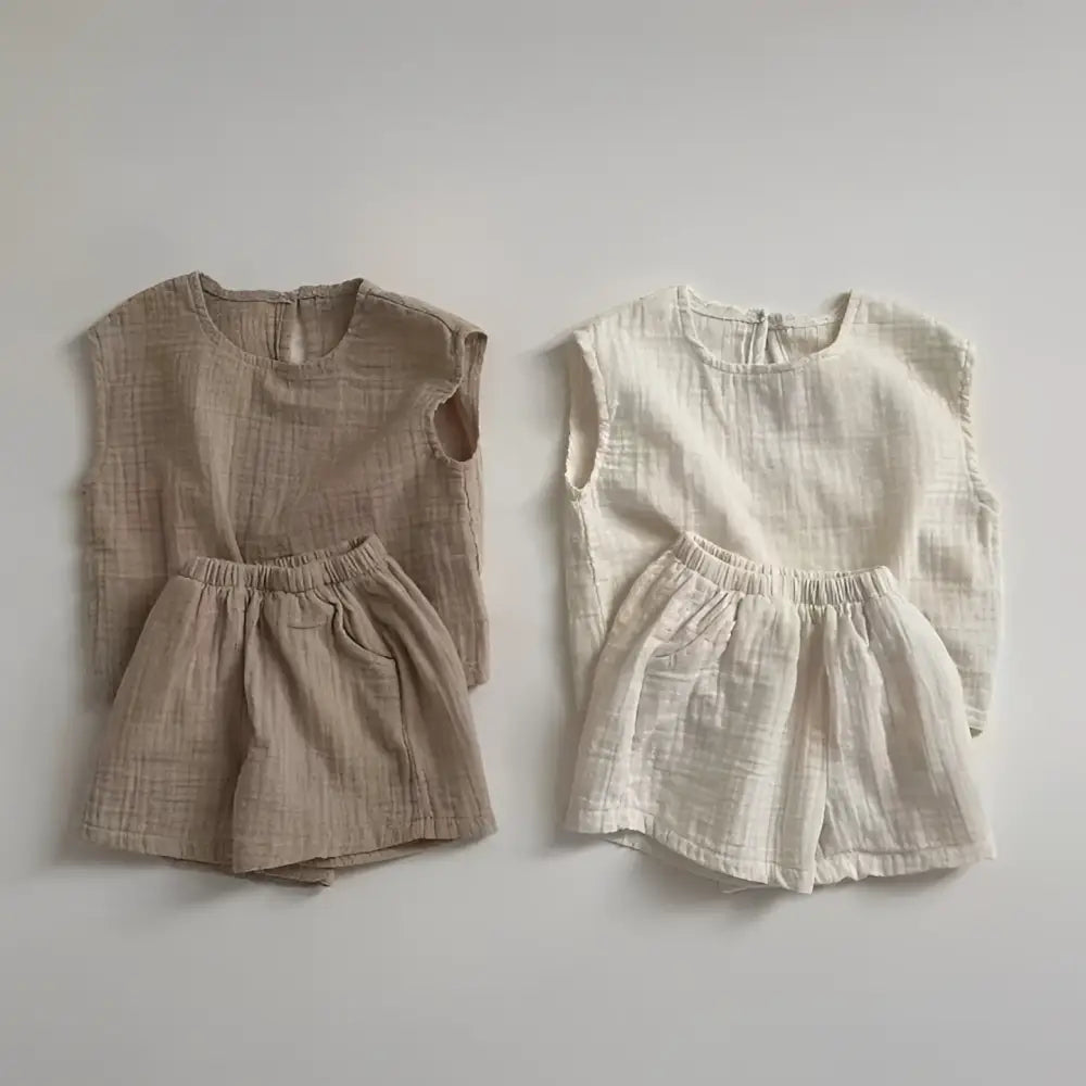 Two matching breathable vest shorts sets in warm beige and off-white cotton muslin breathable fabric