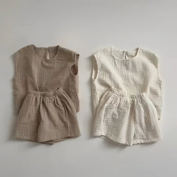 Two matching breathable vest shorts sets in warm beige and off-white cotton muslin breathable fabric