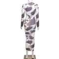 A form-fitting long-sleeved bodycon cow print women irregular hole maxi dress with white and gray abstract cloud pattern