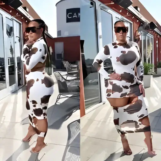 A woman wears a black and white cow print women irregular hole two-piece maxi dress with long sleeves and cutouts