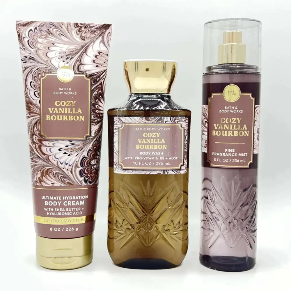 Cozy vanilla bourbon body wash and care set with marbled tube, amber glass bottle, and frosted purple spray for ultimate hydration body