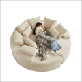 Cream corduroy round recliner sofa with plush ribbed cushions showcasing an ergonomic neck pillow design