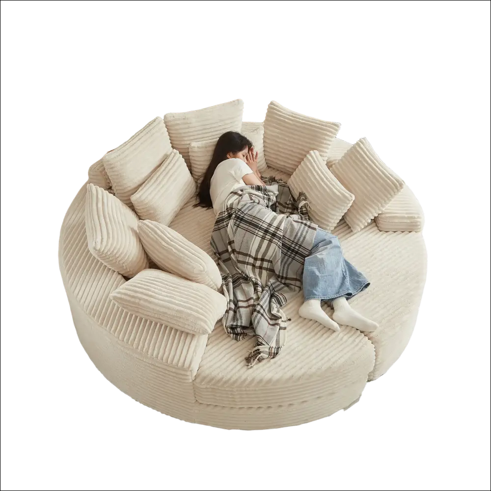 Cream corduroy round recliner sofa with plush ribbed cushions showcasing an ergonomic neck pillow design
