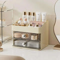 Cream two-drawer countertop cosmetic display case vanity storage with transparent fronts and silver knobs