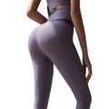 Cream high waisted lavender leggings with fiber blended fabric and subtle seam detailing for embarrassment line fitness use