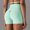 Mint green high-waisted athletic shorts with ruched back pocket design fitness shorts ideal for activewear