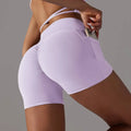 Lavender high-waisted athletic shorts with ruched back and side pocket pocket design fitness for active wear