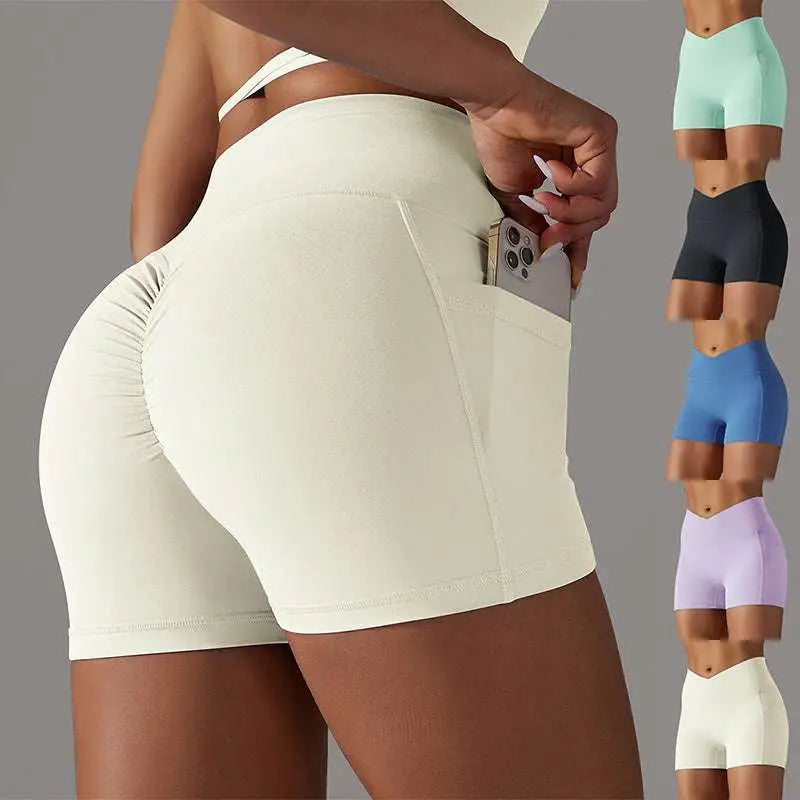 Cream high waisted athletic shorts with ruched back and side pocket design fitness shorts for phone storage