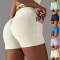 Cream high waisted athletic shorts with ruched back and side pocket design fitness shorts for phone storage