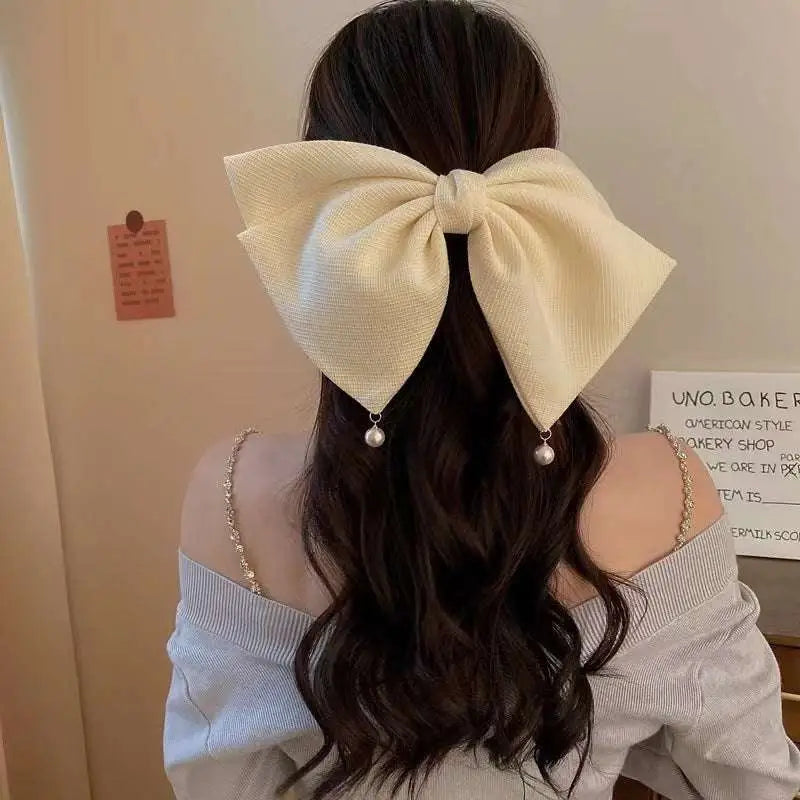 Cream pearl large bow barrettes spring clip featuring cream fabric with pearl drop accents for elegant styling