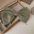 Cream pearl large bow barrettes spring clip in sage green fabric with subtle woven texture and pearl accents