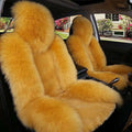 Cream sheepskin winter car cushion in golden fur with plush texture for a soft warm car cushion winter accessory