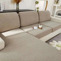 Cream stretchy universal sofa cover in beige with herringbone texture and woven fabric finish for versatile use