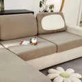 Beige textured cream stretchy universal sofa cover with white inner panel on backrest for universal sofa cover use