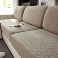 Cream stretchy universal sofa cover with beige woven texture and subtle herringbone pattern for universal sofa cover