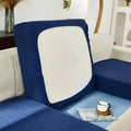 Blue textured sofa cushion cover with white panel displayed with cream stretchy universal sofa cover for protection