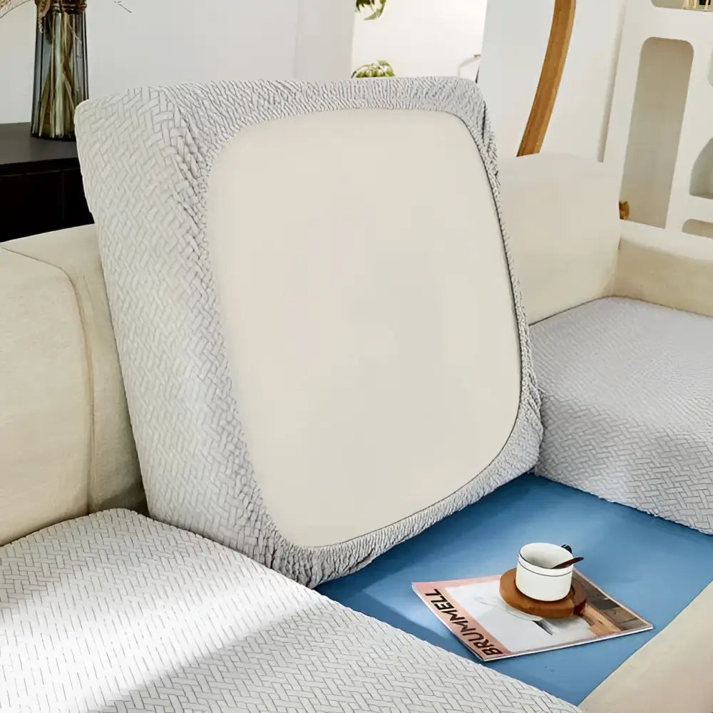 Gray herringbone sofa cushion cover with cream stretchy universal sofa cover featuring smooth center panel texture