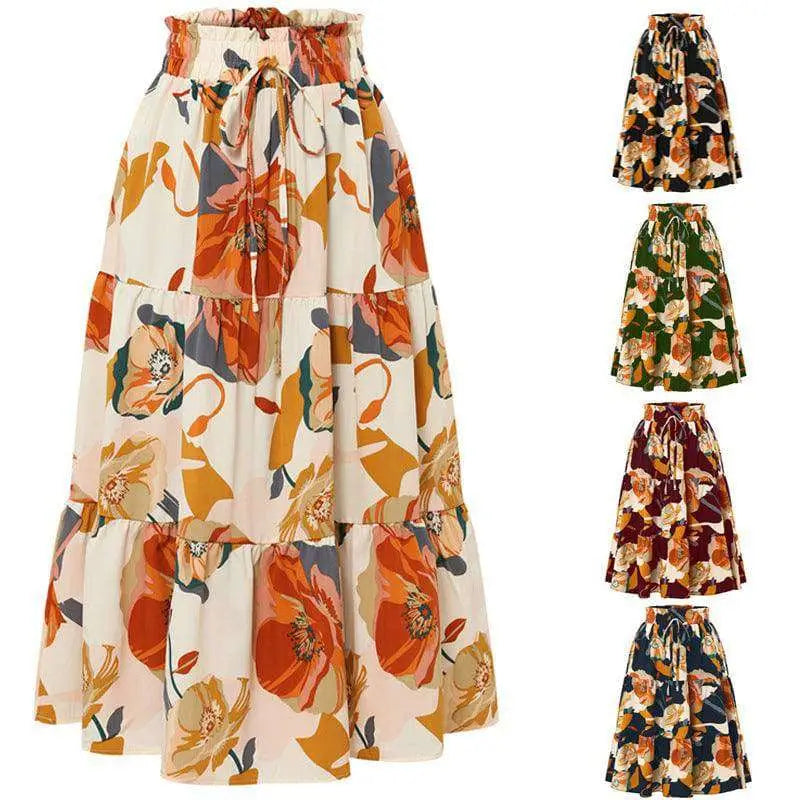 Cream tiered pleated floral elastic waist skirt featuring bold orange and mustard blossoms on flowing fabric