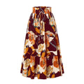 Cream tiered pleated floral skirt with elastic waist drawstring featuring bold maroon orange and cream floral pattern