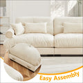 Cream velvet size modern sofa with cream leather tufted cushions and round bolster armrests in a sleek design
