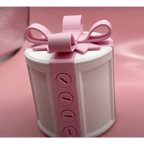 A white cylindrical valentine day gift box with a creative bowknot pink ribbon bow and four circular button details