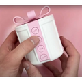 A white valentine day gift box with creative bowknot pink ribbon bow and pink paper strip with button designs